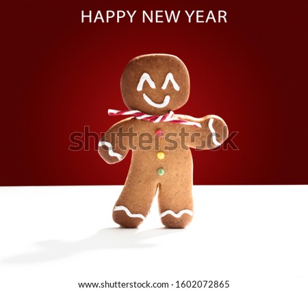 Happy new year text. Cookie man on red background and white background