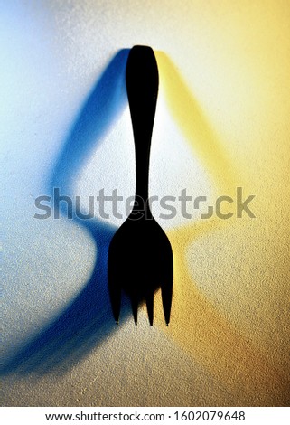 The shadow color curved from the fork as a subject.