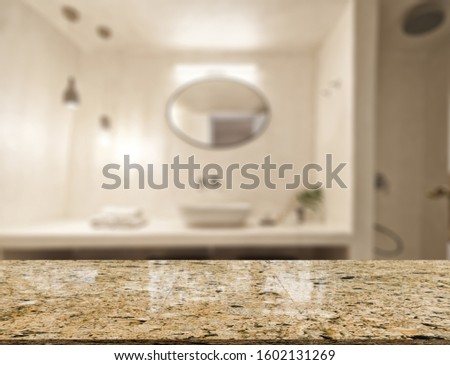 Empty marble top table with blurred bathroom interior Background.