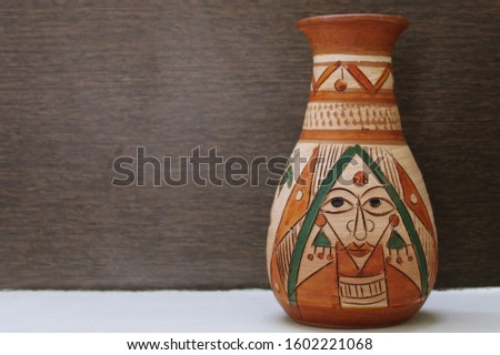 Clay vase Handcrafted Earthern Pot with traditional artwork close up Royalty-Free Stock Photo #1602221068