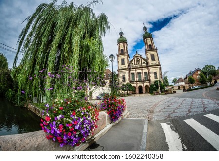 The square in front of the magnificent church of Ebersmunster Royalty-Free Stock Photo #1602240358