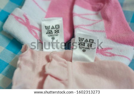 Clothes and socks for newborn babies and clothes tags