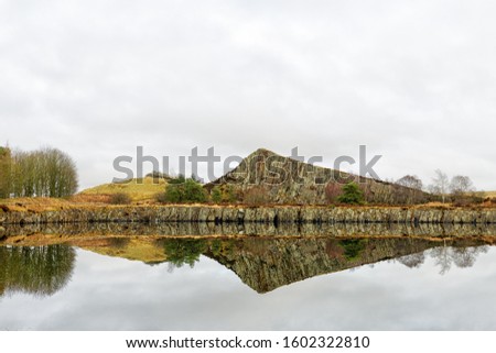 A section through the Whin Sill at Cawfields, Northumberland, England on the line of Hadrian's Wall. Royalty-Free Stock Photo #1602322810