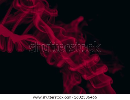 A red abstract pattern over a black backdrop. 