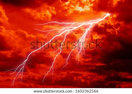 dramatic Red clouds and lightning for pattern background. A burning sky in a horror movie.  crimson storm in apocalyptic, judgment day.