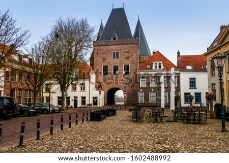 City view at the"koornmarktspoort" a city gate and a little piece of the medieval citywall in Kampen a Hanze-city in the Netherlands, province Overijssel Royalty-Free Stock Photo #1602488992