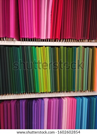 colorful upholstery fabric samples like color swatches background arranged in textile Shop