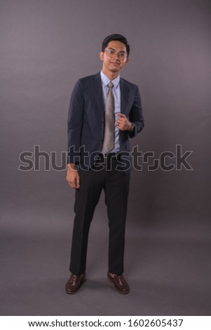 Portraiture of Young male intrepreneur or business man.Studio shot.