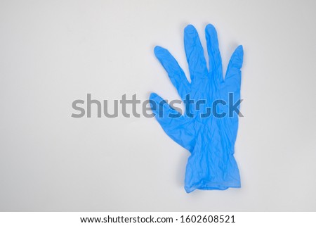 blue rubber gloves for cleaning the room