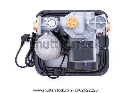 Close-up electric water motor pump machine  isolated on white background. Top view. Flat lay.