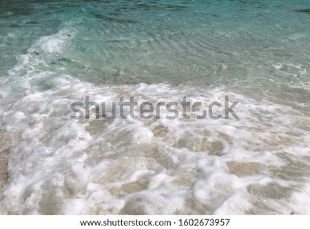 Sea Waves on the Sandy Beach in the Maldives