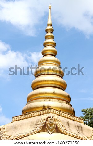 Golden pagoda on blue sky