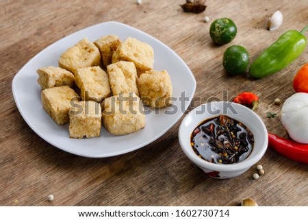 Fried tofu served warm with soy and chili sauce.