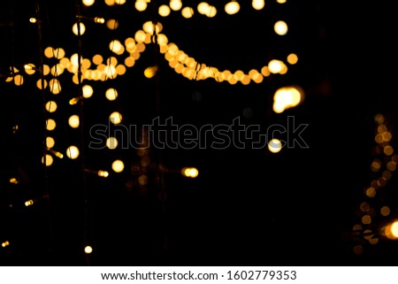 Yellow bokeh background from decorative light of a city on Christmas and New Year celebration