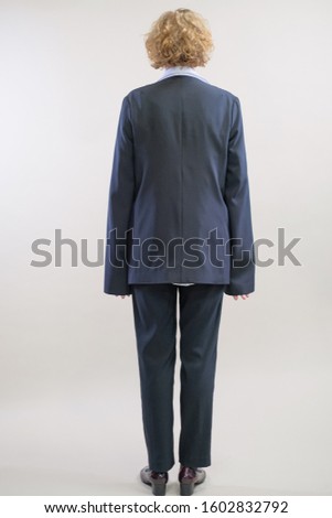 a girl in stylish clothes is photographed for a fashion magazine