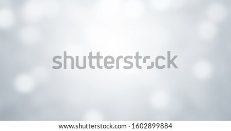 Subtle background, Abstract light grey blurred with photographic bokeh