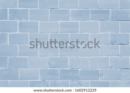 Cracked and textured blue wall, brick wall background. Color of the year 2020 concept. Close up. Fashionable classic blue color of spring-summer 2020 season from New York fashion week.