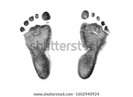 Baby footprints on transparent paper. Black footprint isolated on white background Royalty-Free Stock Photo #1602940924