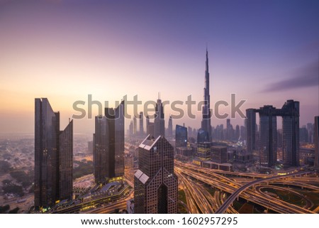 Urban skyline and cityscape at sunrise in Dubai UAE. Royalty-Free Stock Photo #1602957295