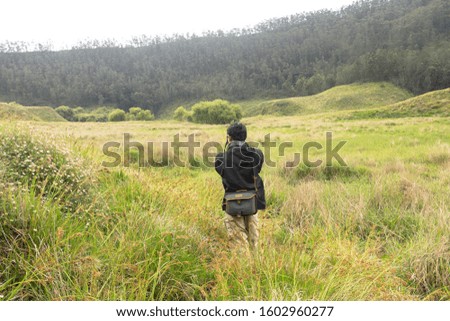 Traveler man walking at Nature, copy space
