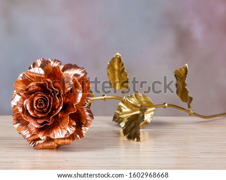 unfading copper red rose as symbol of everlasting love