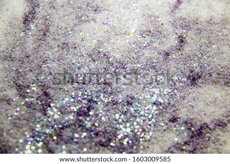 A purple glitter with sugar. Composition with glitter and sugar against background. Beautiful and textured background.
