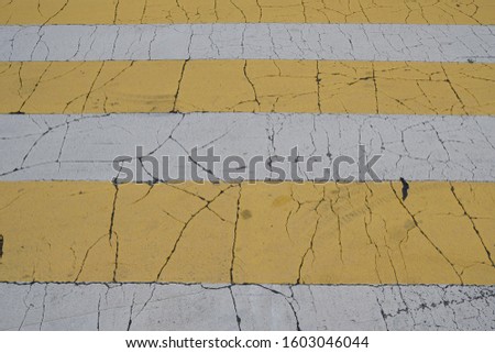 Asphalt road crosswalk marking lines with white and yellow stripes in Seoul , South Korea