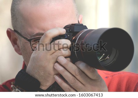 photographer taking photos in the street
