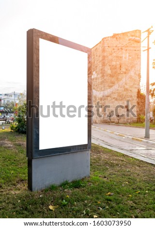 Pylon mock up in the city on sunny day. Blank billboard mockup