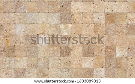 Seamless wall background with Yellow natural sandstone tiles stitched together with clay Royalty-Free Stock Photo #1603089013