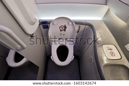 Inside Airplane lavatory .Small space  Inside the airplane toilet