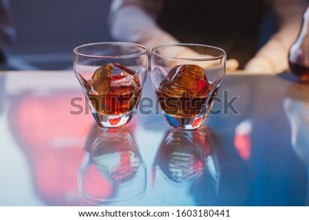 Two glasses of whiskey on ice set. Concept of luxury fine dining.