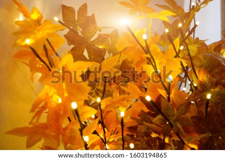 Golden garland on the flowers. christmas background