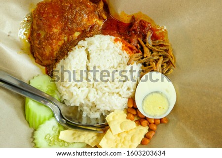 A picture of cafe style "nasi lemak rendang" for breakfast.