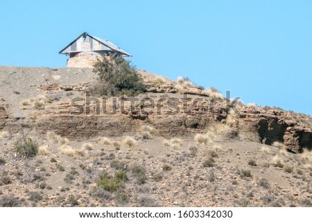 The blockhouse on Koeelkop (bullet hill) in Carnavon in the Northern Cape Karoo region, was was used by the English forces to guard over the town during the Second Anglo Boer War Royalty-Free Stock Photo #1603342030