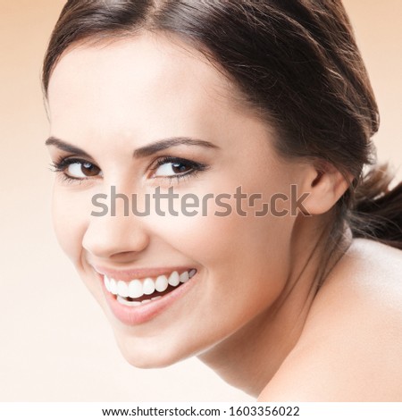 Young happy smiling woman, over color background. Caucasian female model in beauty, healthcare, skincare, face, dental health concept picture. Square composition.