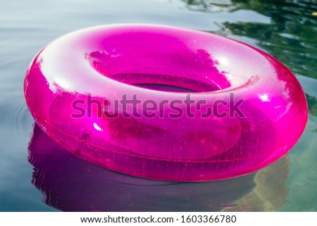 donut inflatable pink circle close up in swimmingpool