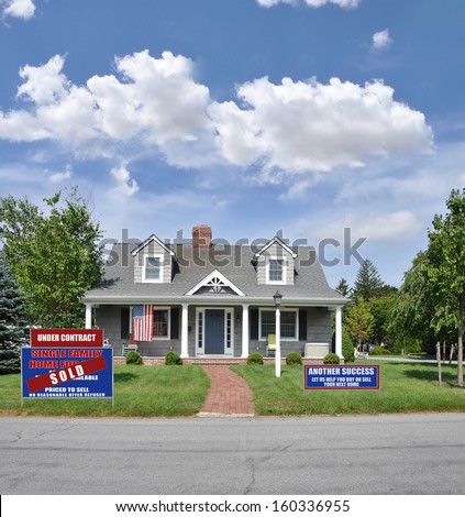 Real Estate Under Contract Sold For Sale Sign and Another Great Success We Can Help you Buy Sell your next home sign American Flag sunny blue sky clouds USA residential neighborhood