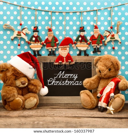 nostalgic home christmas decoration with antique toys. vintage arrangement  and blackboard with sample text Merry Christmas