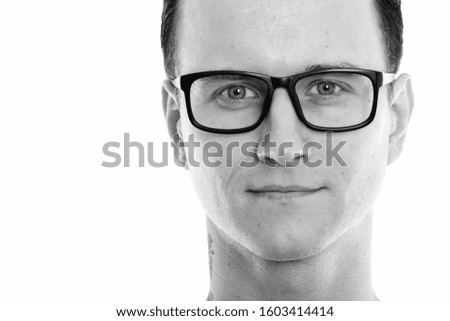 Close up of young handsome man wearing eyeglasses
