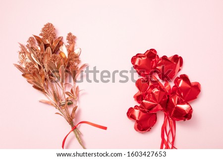 Valentine Day background with red balloons, flowers, confetti, hearts on pink background. Abstract flatlay