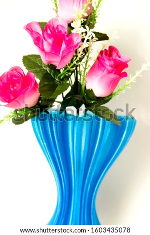 pictured in the photo blue cup full of small pink roses