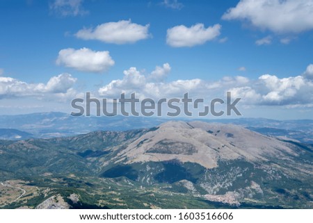 aerial, from a small plane, of Raparo peak, shot in bright summer light from south,  Potenza, Basilicata, Italy
