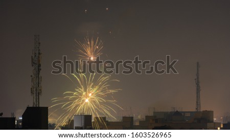 Bursting fireworks during the Divali festival of light over the city of Chennai in South India