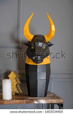 geometric black bull mask with Golden horns made of paper