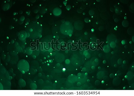 Abstract bokeh lights with light green background, beautiful bokeh from water droplets
