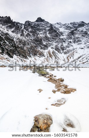Black Pond or Czarny Staw and Rysy Peak in Tatra Mountains at Winter in Poland