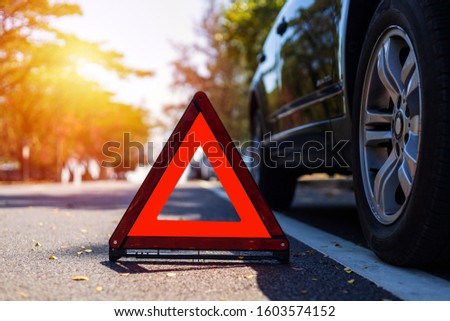Red triangle, red emergency stop sign, red emergency symbol with  car stop and park on road.