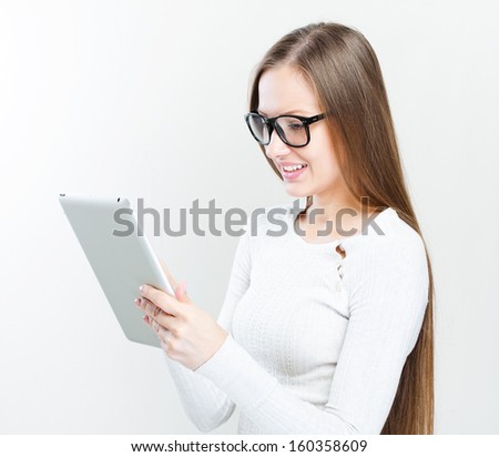young woman holding tablet computer