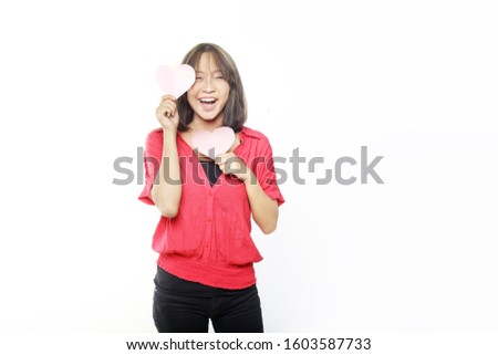 young woman heart using red shirt isolated